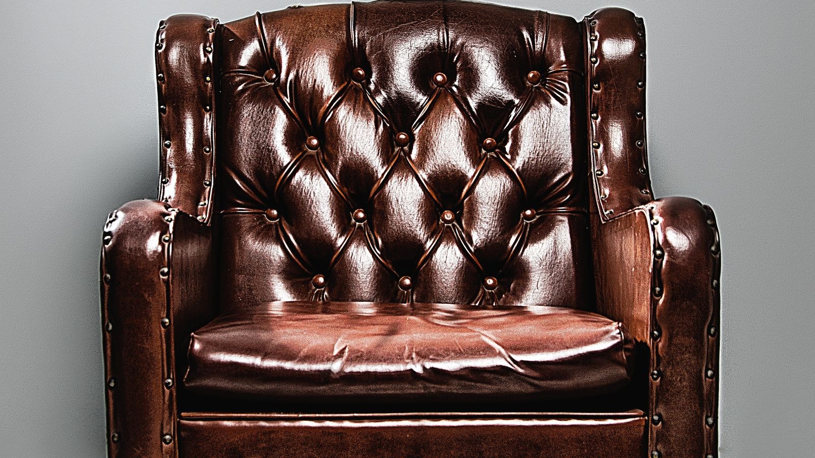Brown leather armchair recliner in a living room setting