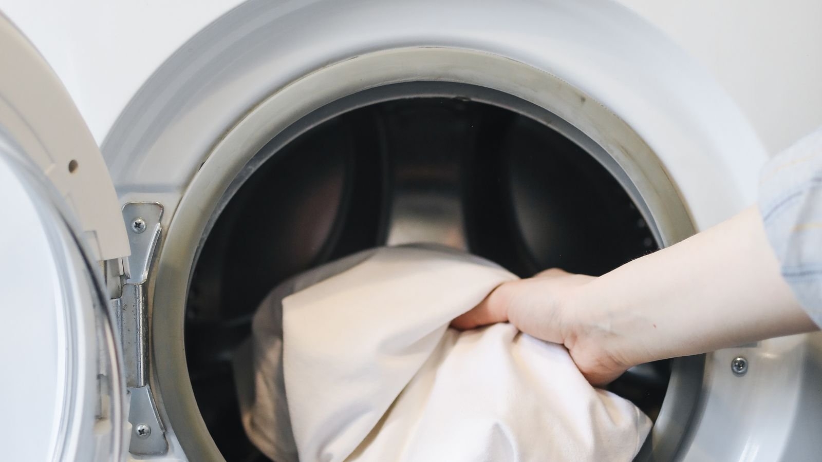 Front loading washing machine with door open showing the rubber gasket seal