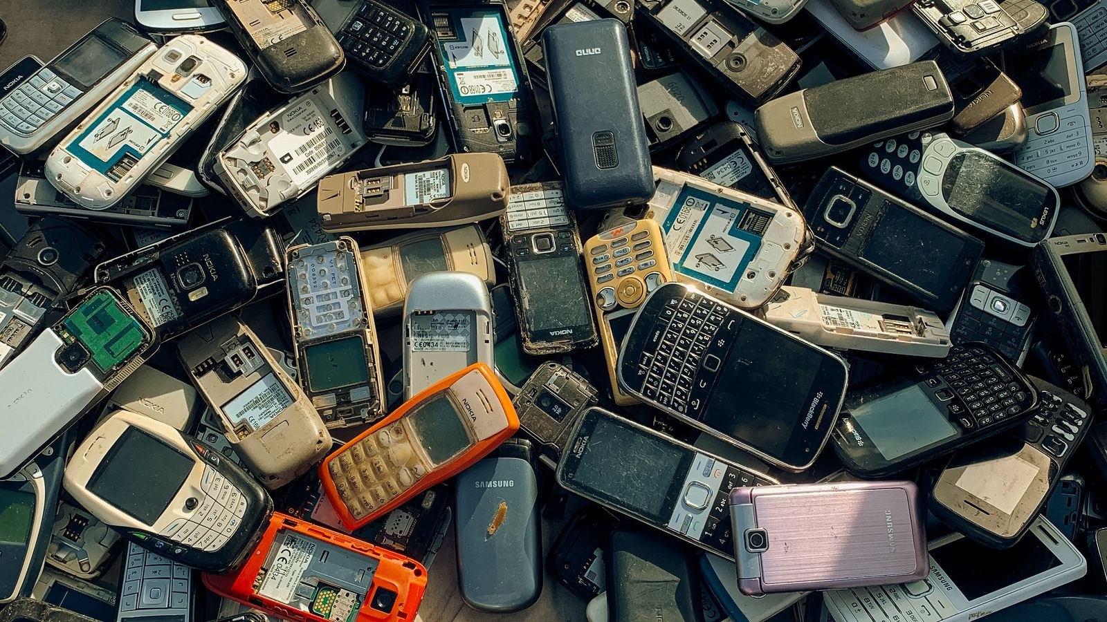 Collection of obsolete electronic devices gathered for recycling