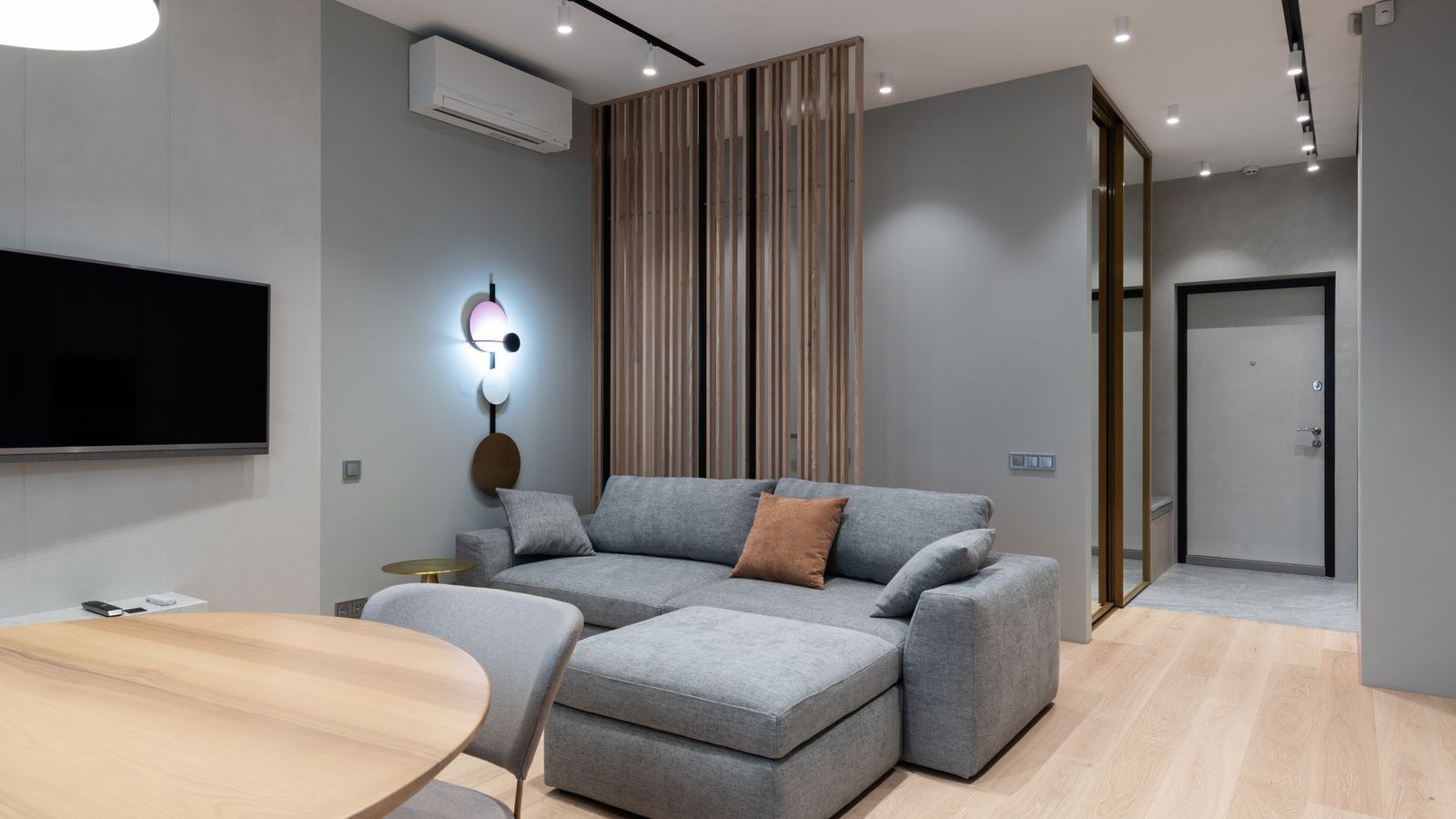 Living room with a wall-mounted air conditioning unit cooling the space