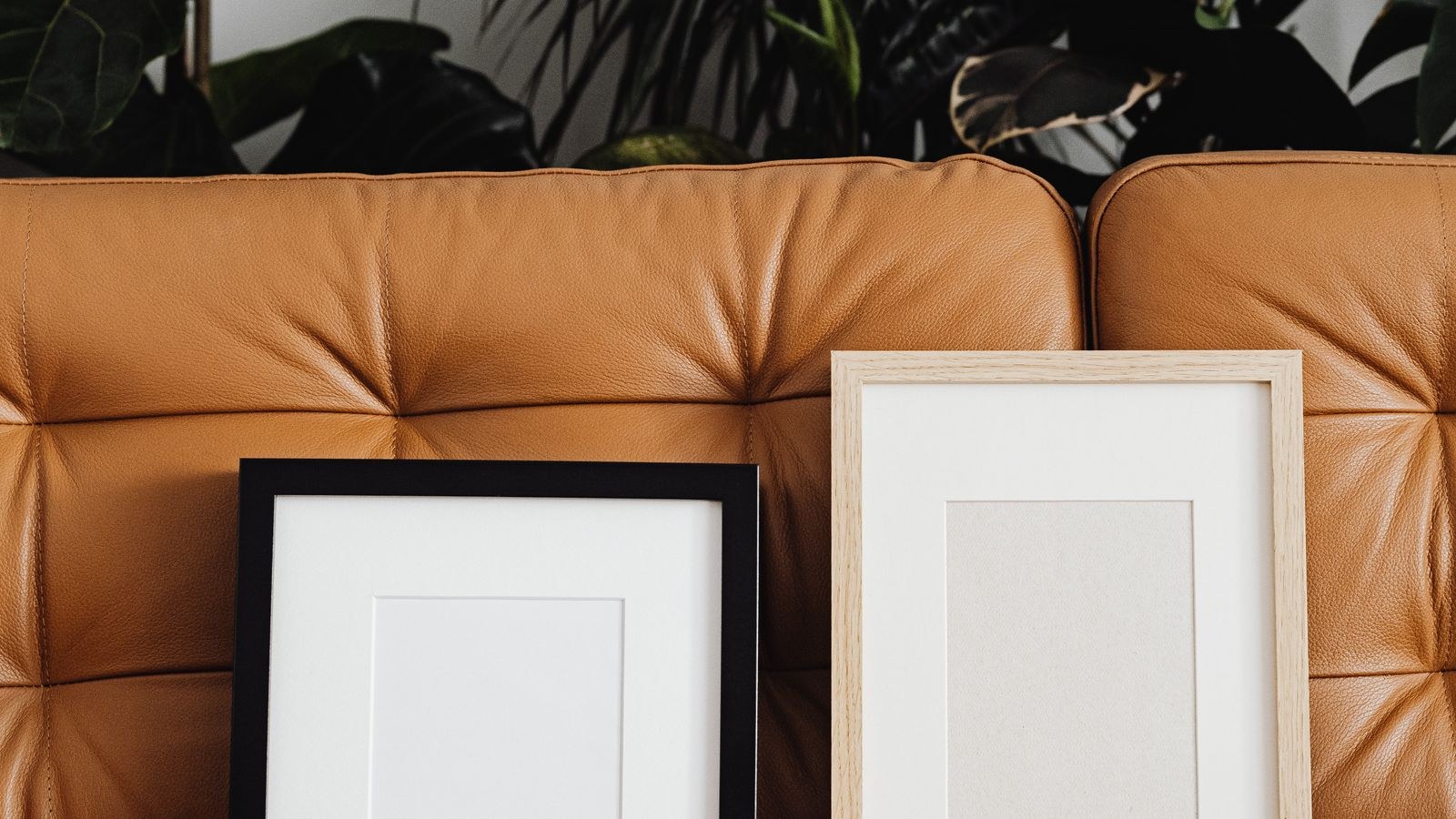 Wall art positioned above a console table with a lamp and decor objects