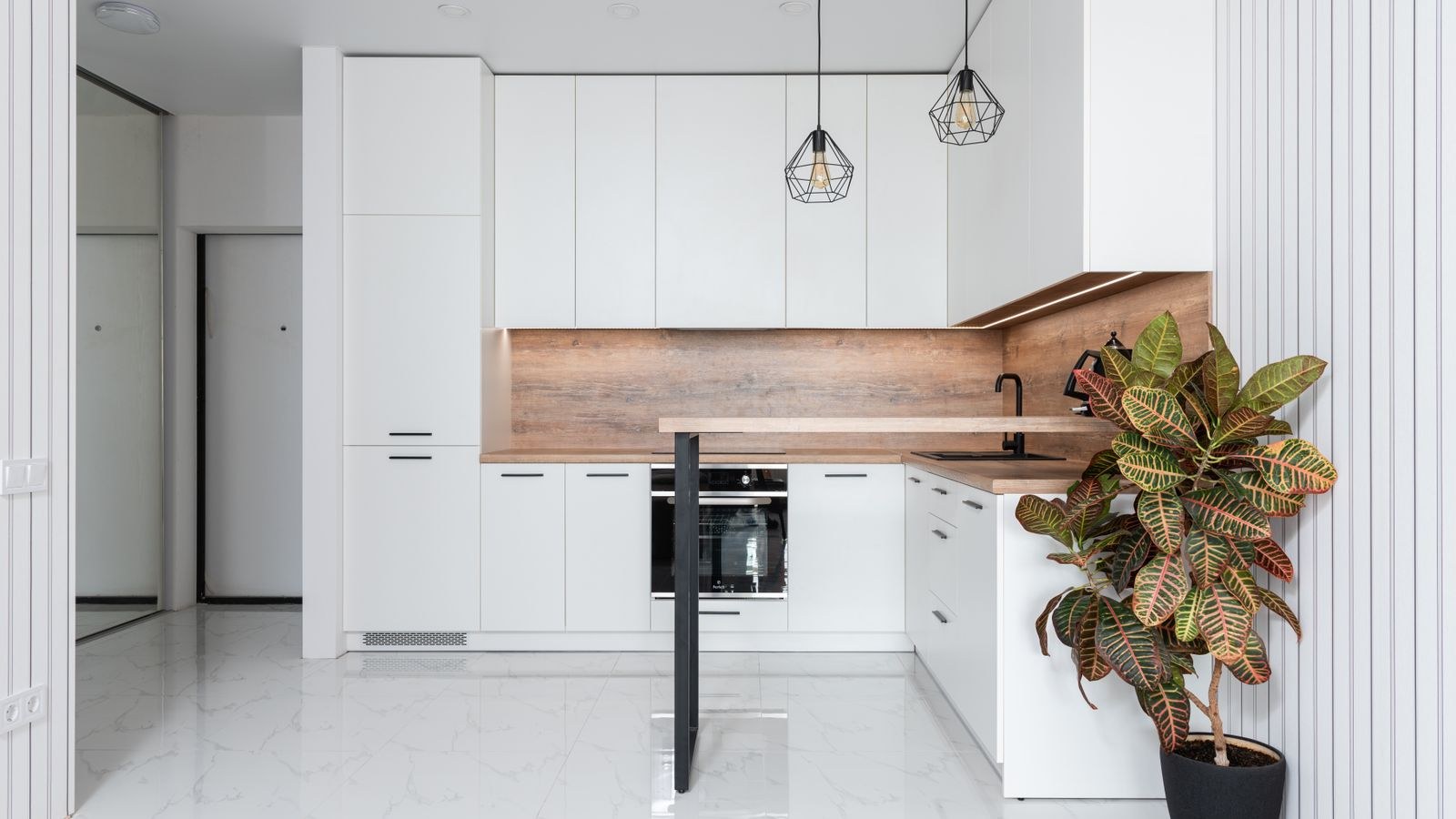 Hardwired under cabinet LED lighting above a kitchen countertop