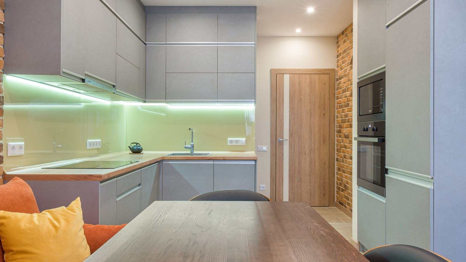 Close view of puck lights mounted under a kitchen wall cabinet