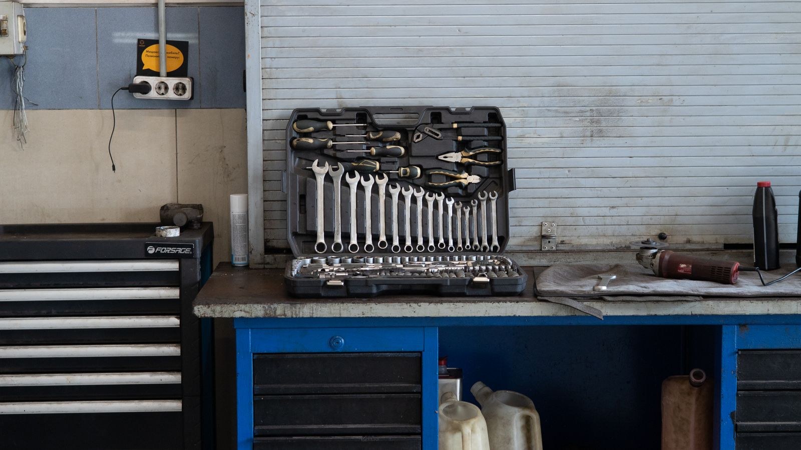 Well organized workbench with hand tools under bright task lighting
