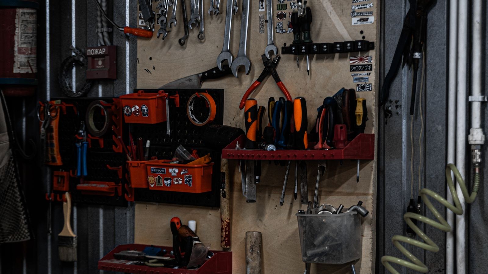 Organized garage workshop with tools stored neatly on wall racks