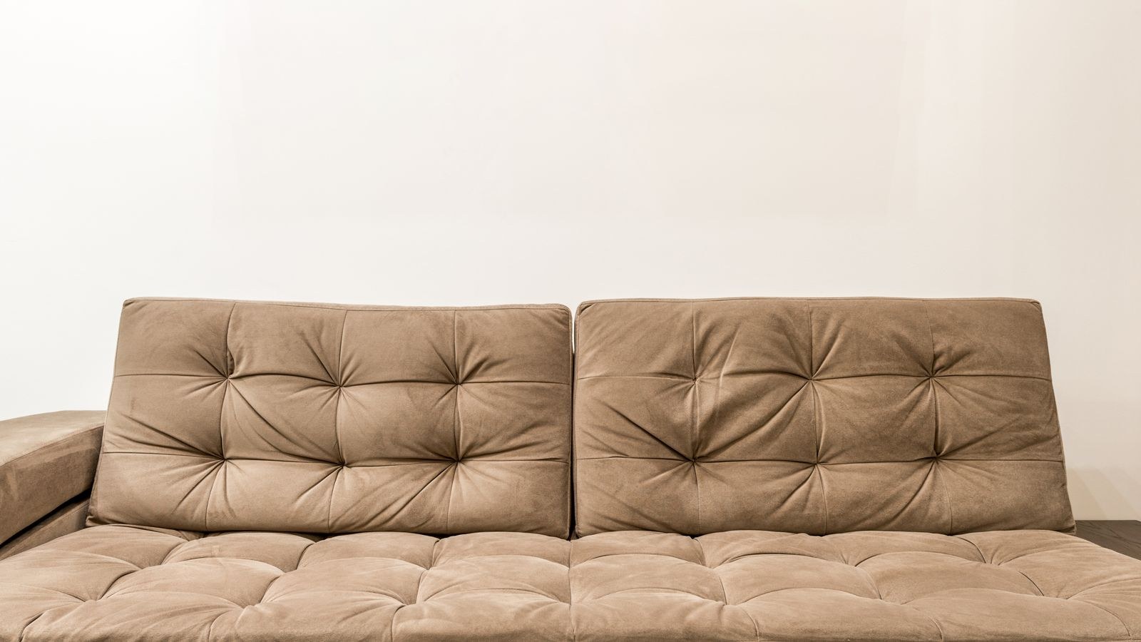 Pull out sleeper sofa with pillows and duvet in a guest living room