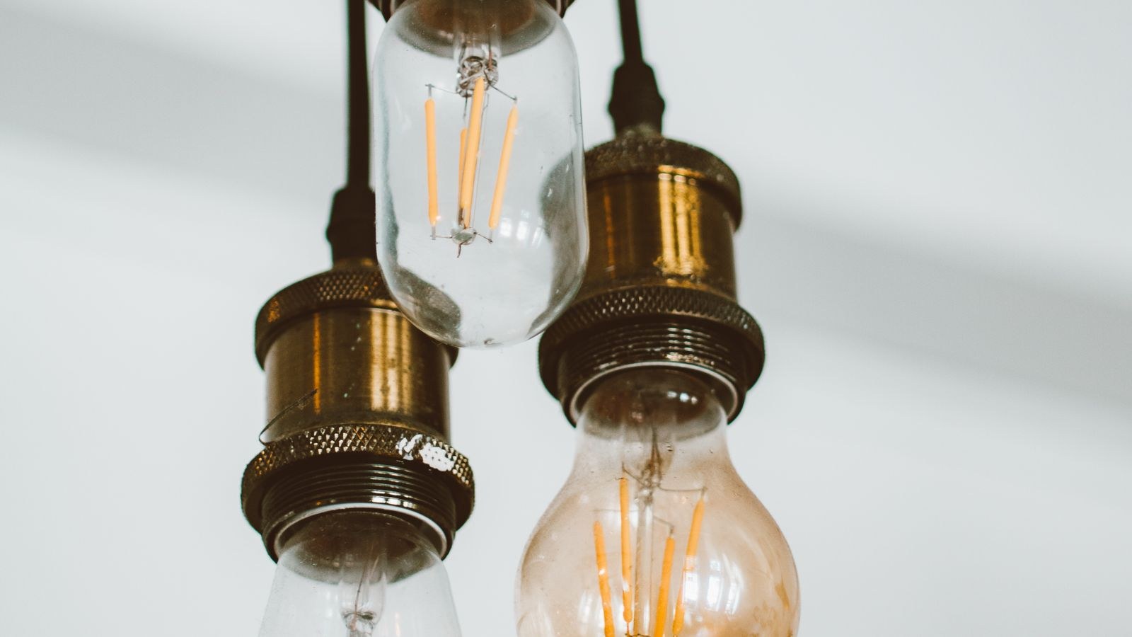 Row of LED bulbs on a shelf showing colour temperature labels