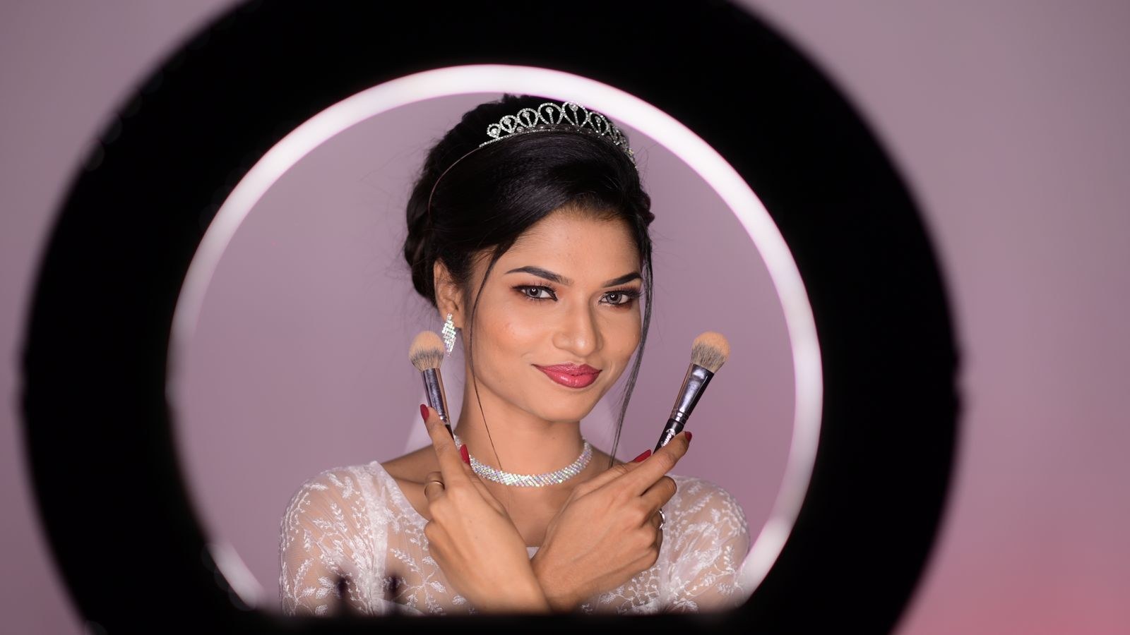 Ring light illuminating a face evenly during a makeup application