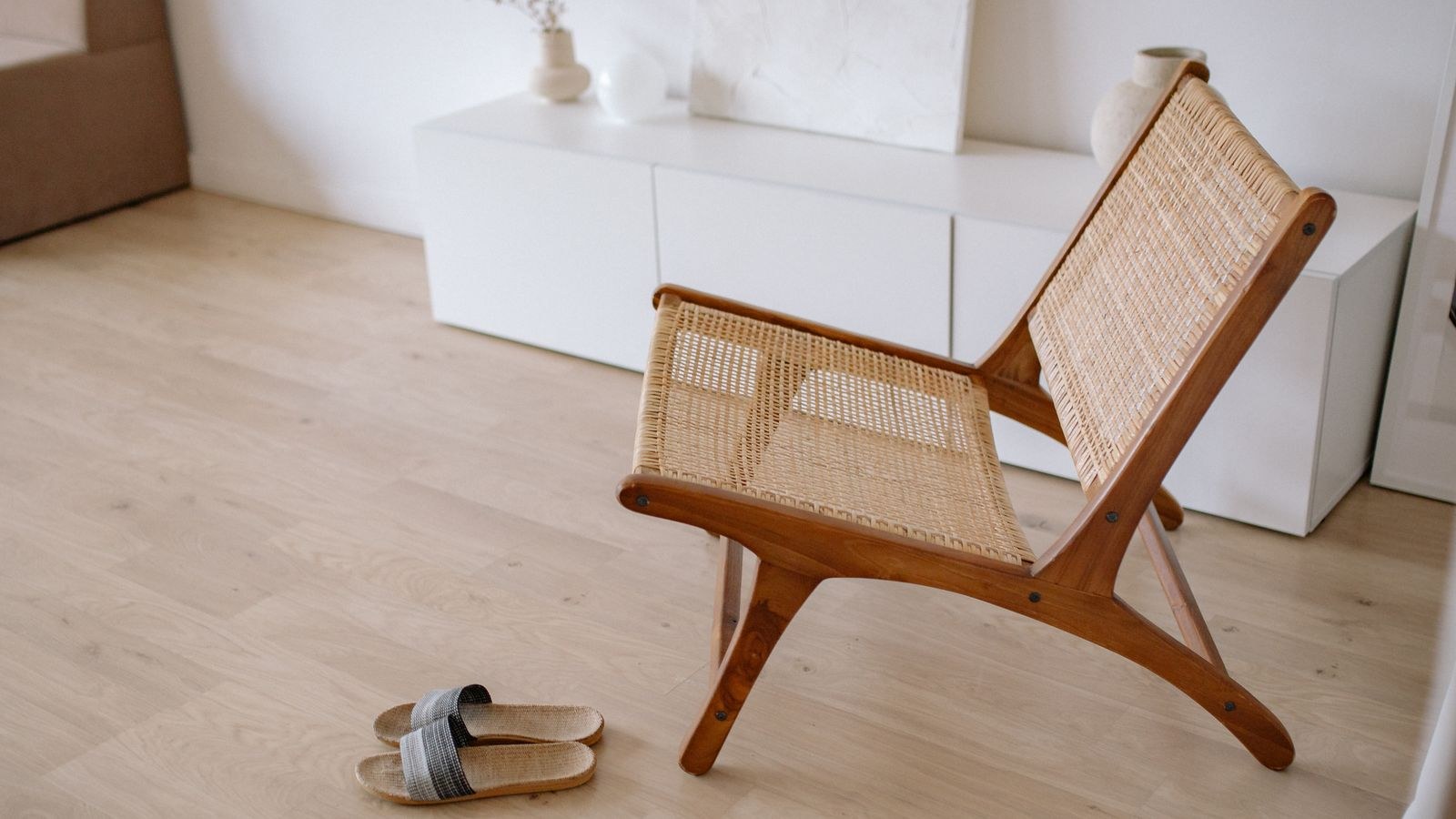 Felt pads and glides fitted to the bottom of a wooden furniture leg