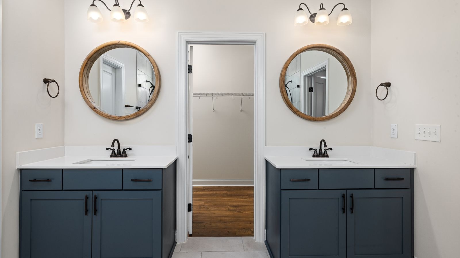 Modern bathroom vanity with mirror and wall mounted light fixture