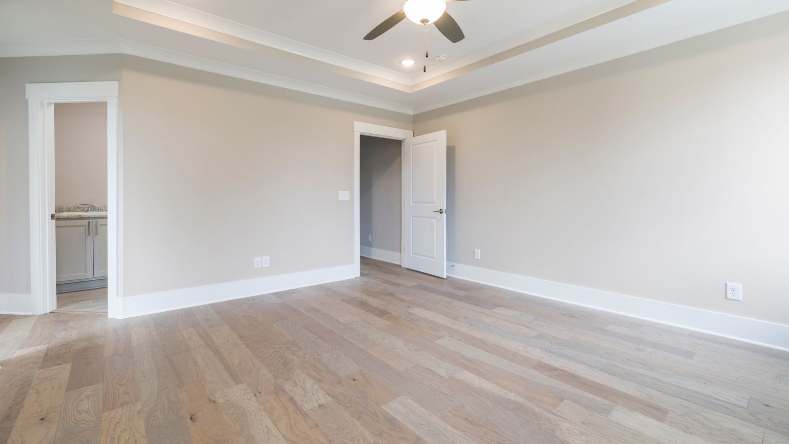 Ceiling fan blades and light kit installed in a living room