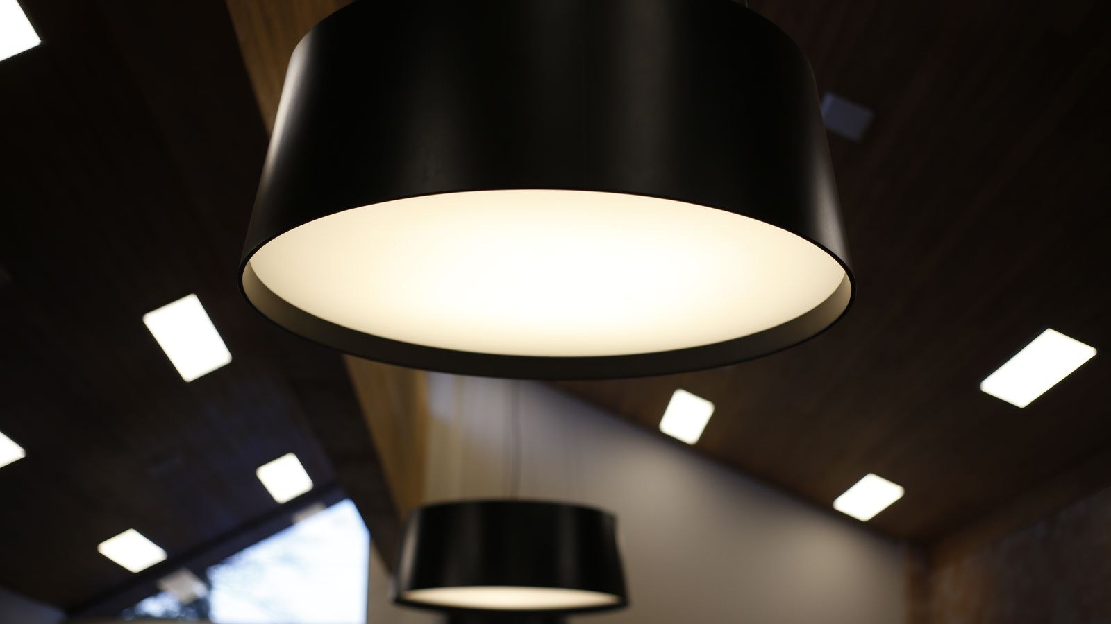 Pendant ceiling light hanging in a room after fixture replacement