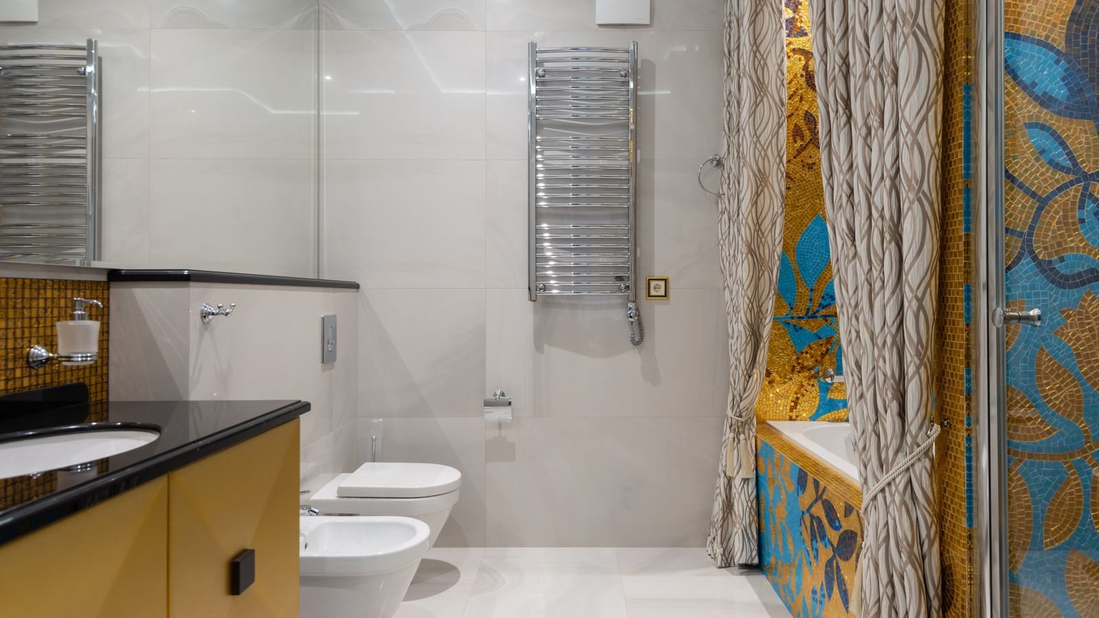 Bathroom shower area with a fresh curtain liner and tiled walls