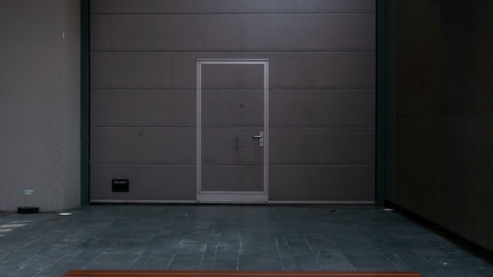 Modern garage door design on a secured residential property