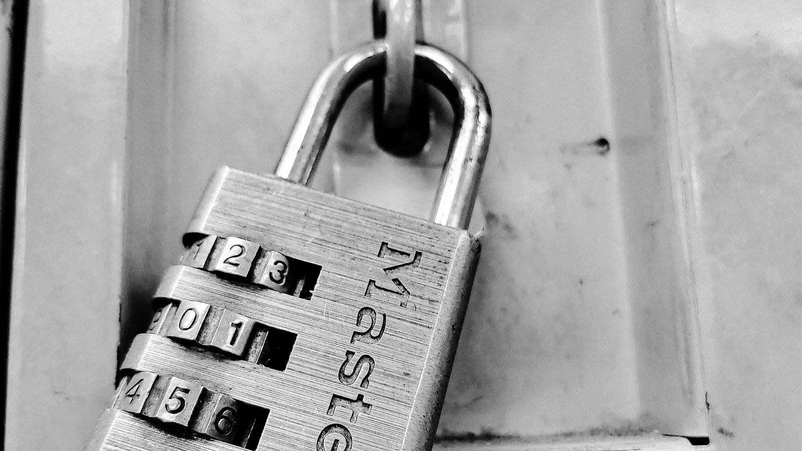 Close up of a combination dial lock showing numbered wheel positions