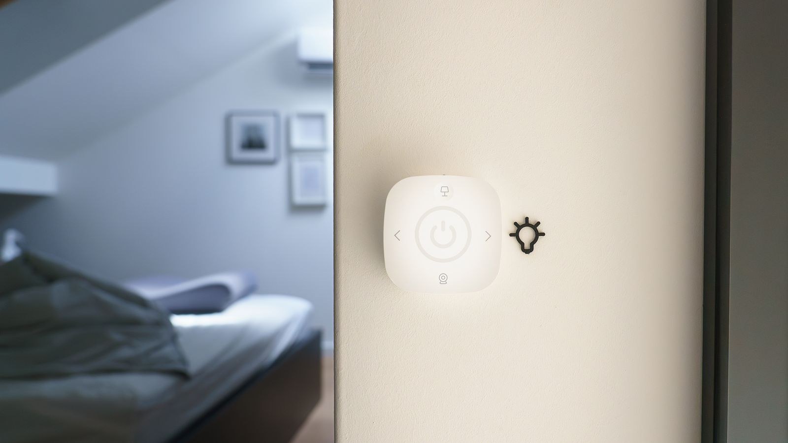 Minimalist bedroom with a smart lighting control on the wall for evening scenes