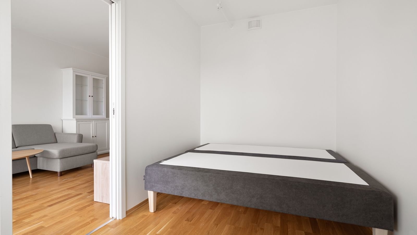 Comfortable living room seating arranged as a guest sleeping space