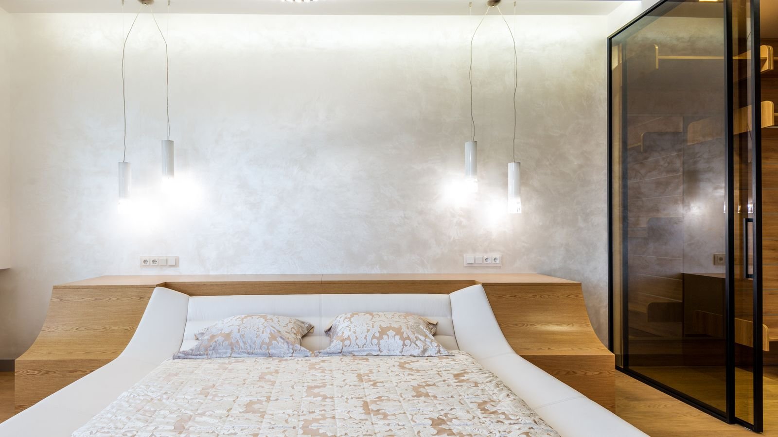 Cosy bedroom with warm LED accent lighting along the wall