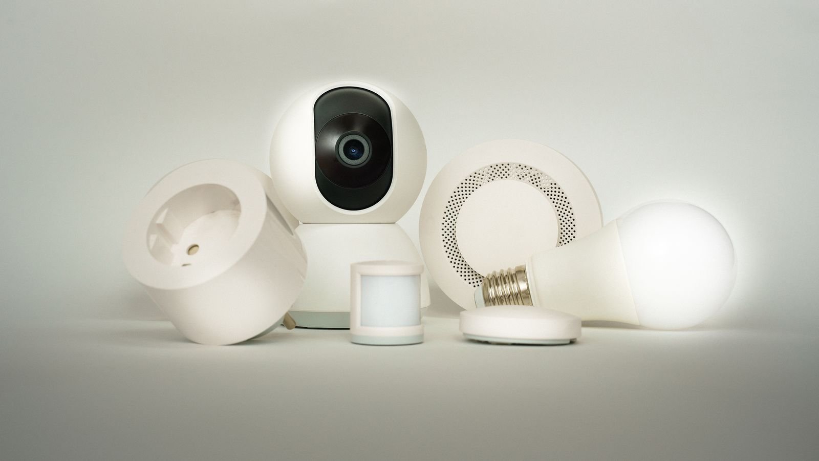 Collection of smart home devices including plugs sensors and a camera