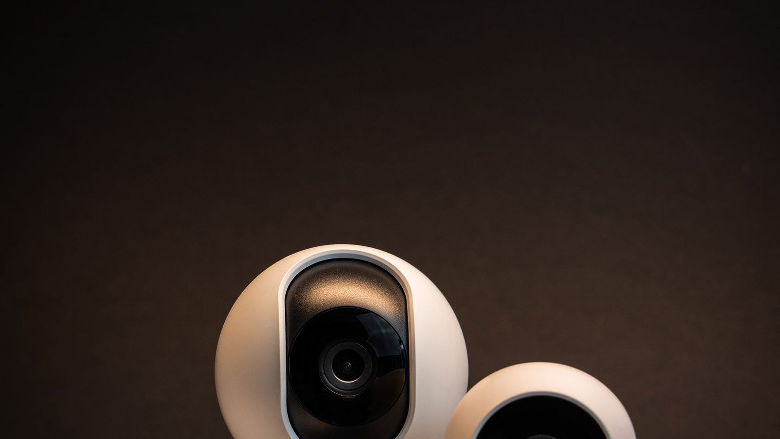White home safety sensors and detectors against a dark background