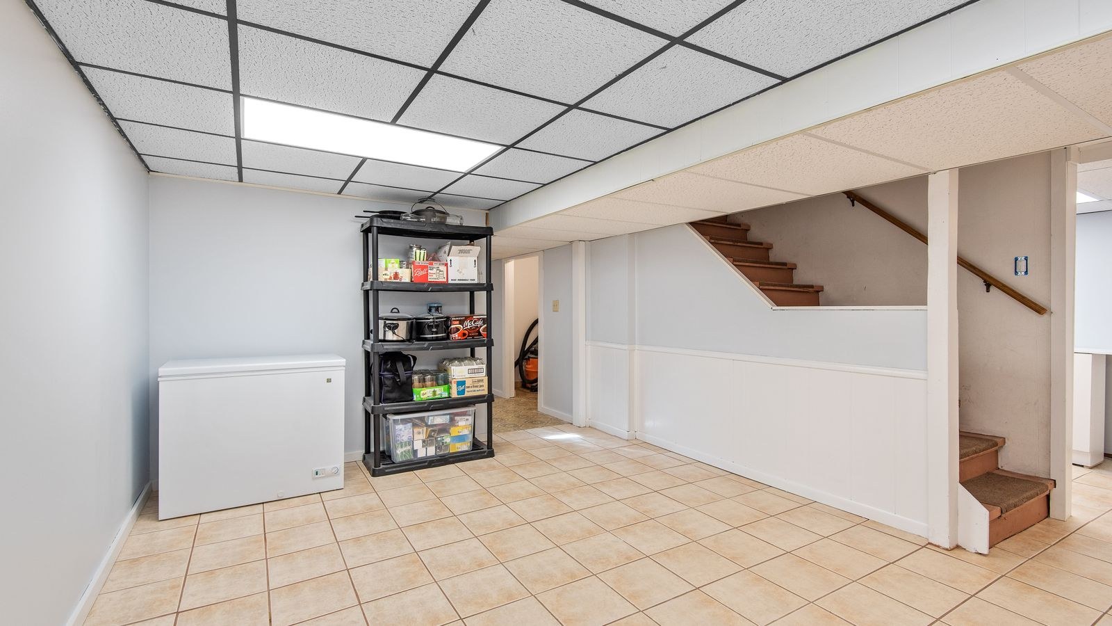 Basement storage area with shelving suitable for storing a window air conditioner over winter