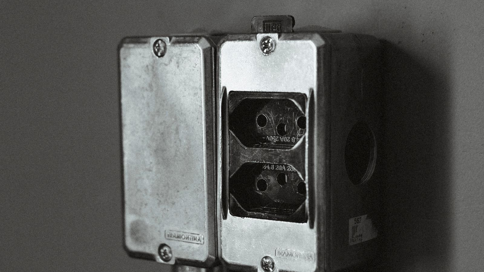 Person using a phone app to configure a smart plug on a home network