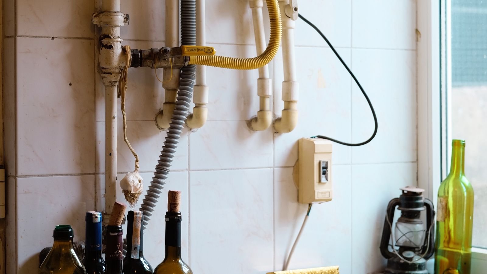 Insulated water heater pipes and valves protected against freezing temperatures