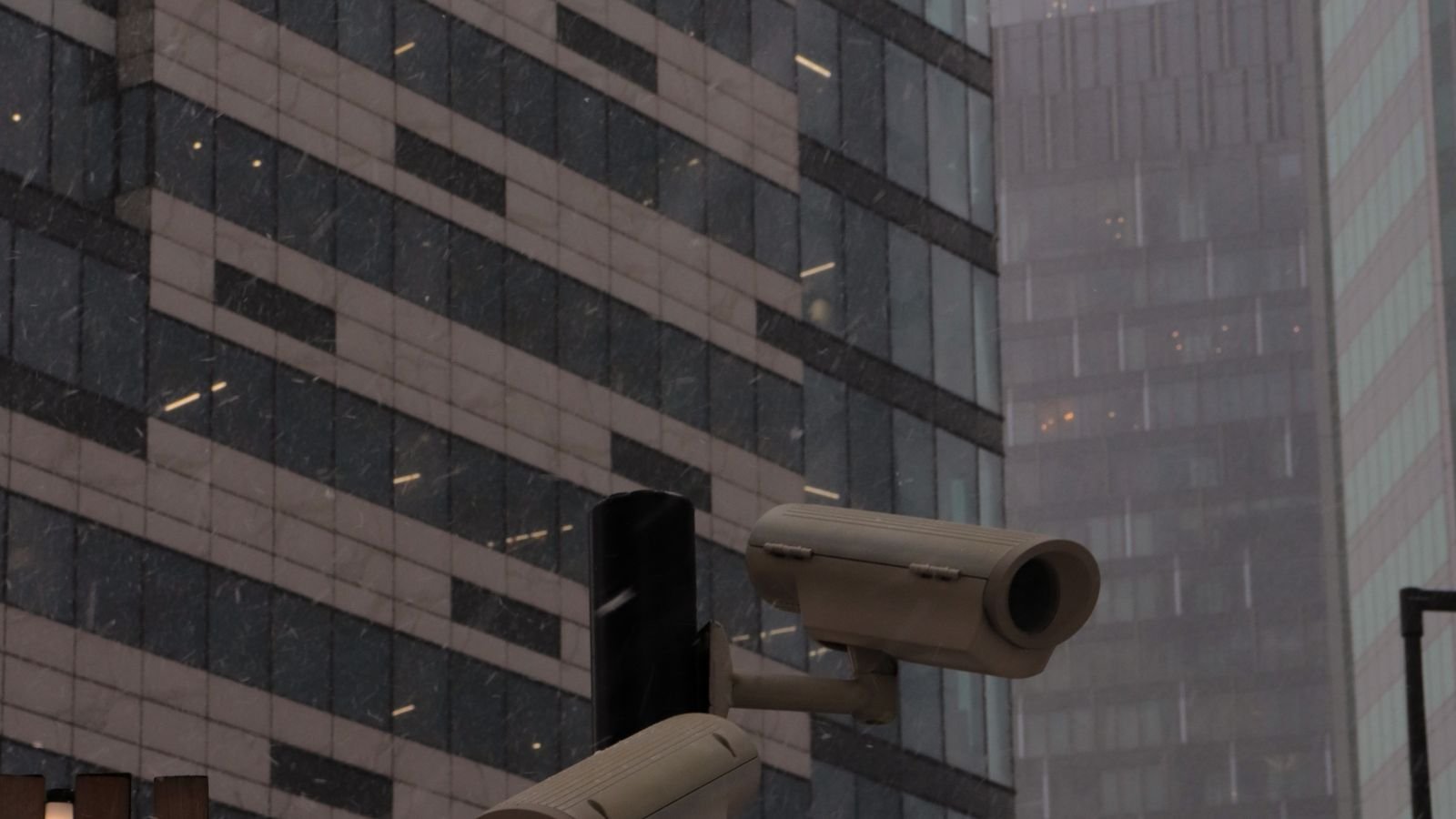 Security camera mounted under a roof eave protected from snow and ice in winter