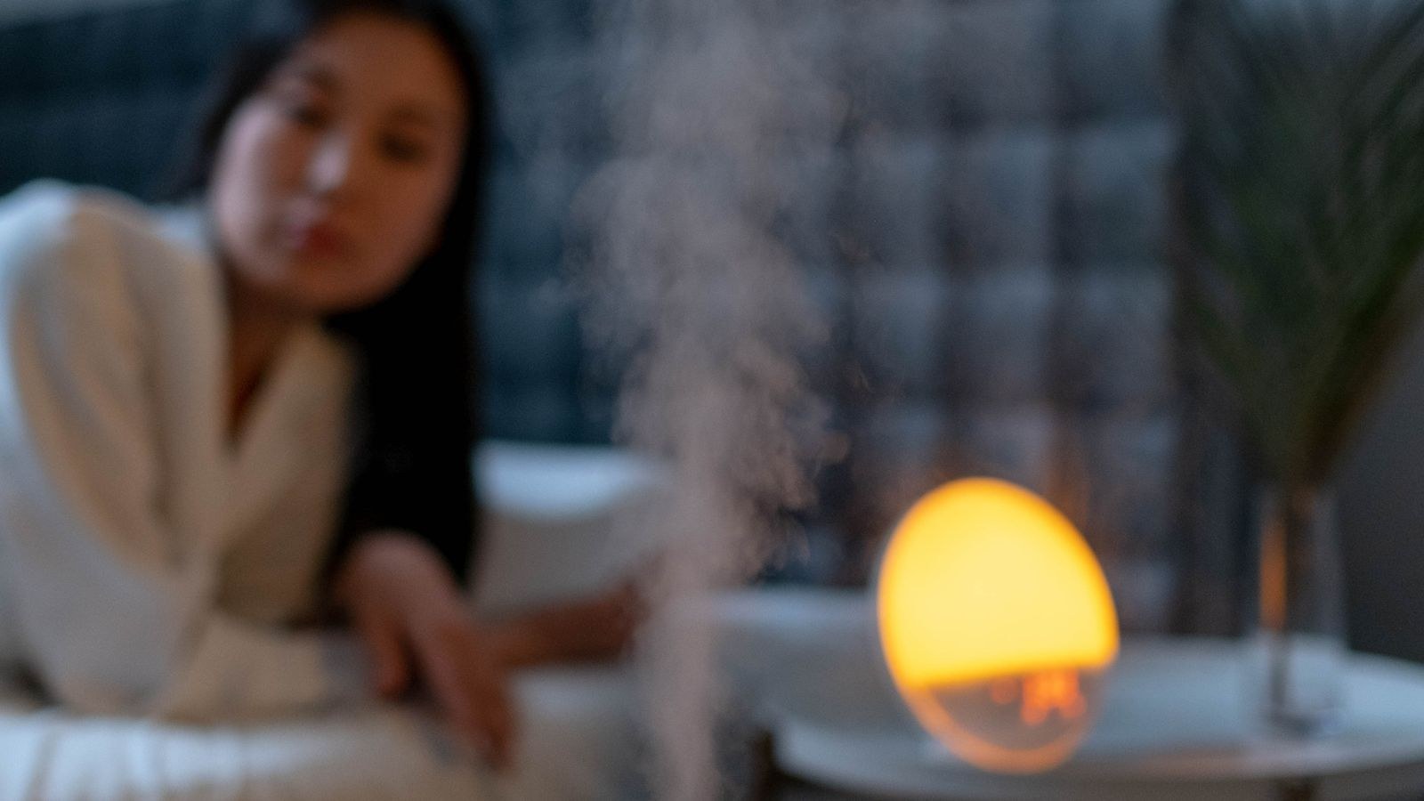 Bedroom with a humidifier running to maintain comfortable winter humidity levels