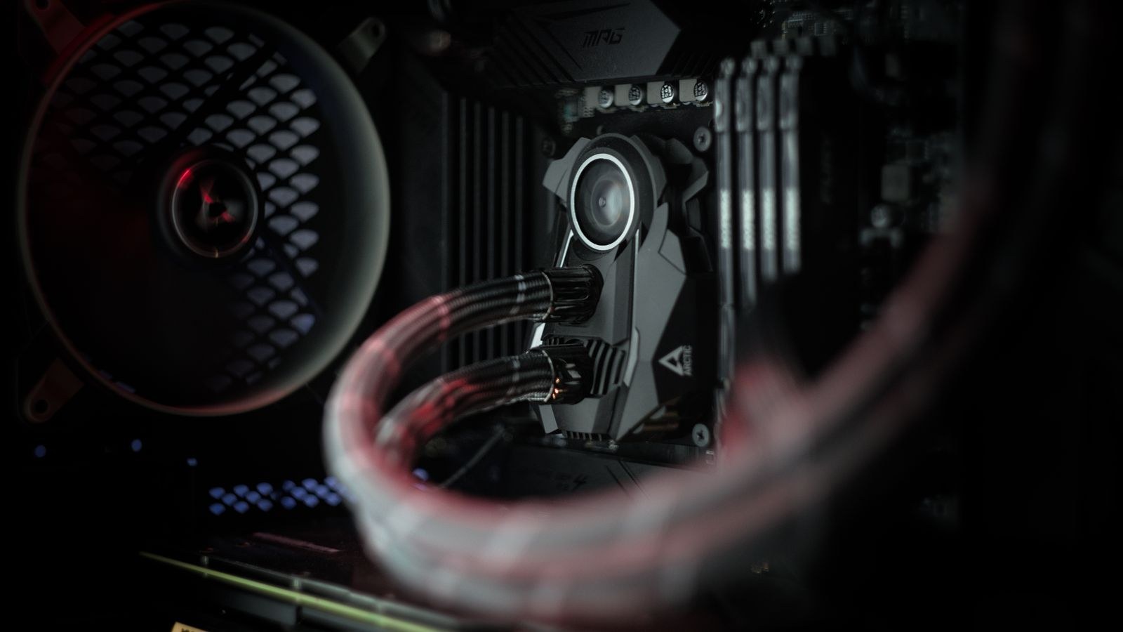 Illuminated liquid cooling system inside a desktop computer after AIO installation
