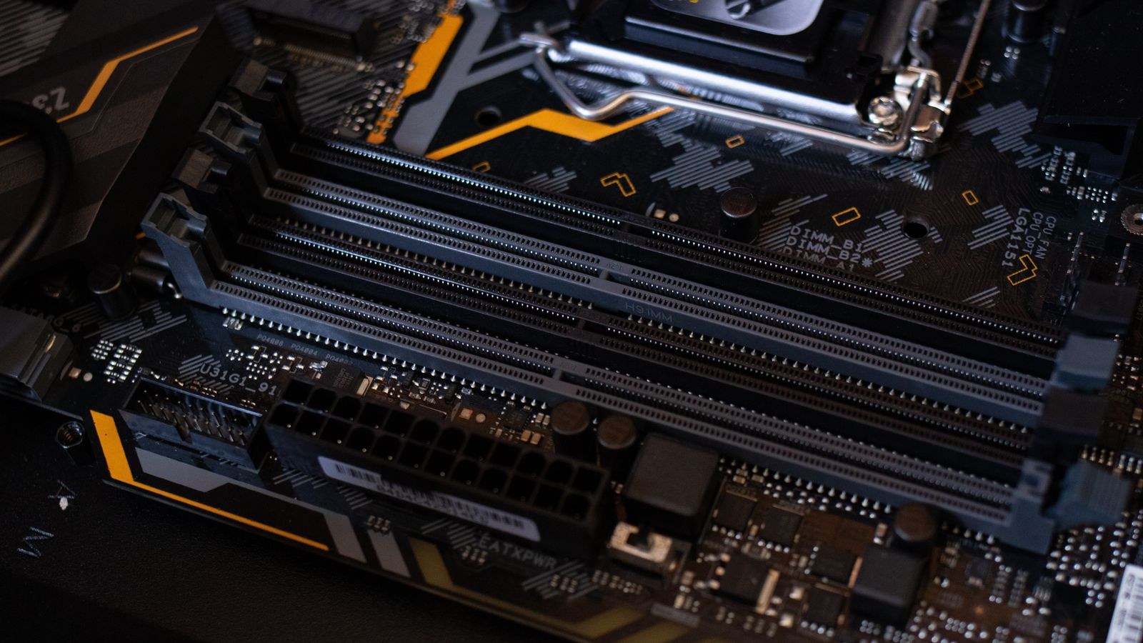 Motherboard showing RAM slots and surrounding electronic components