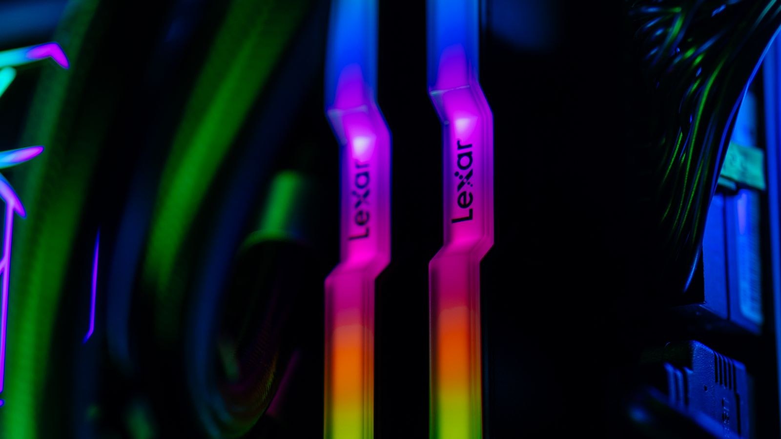 Glowing RGB RAM sticks installed in a custom gaming PC build