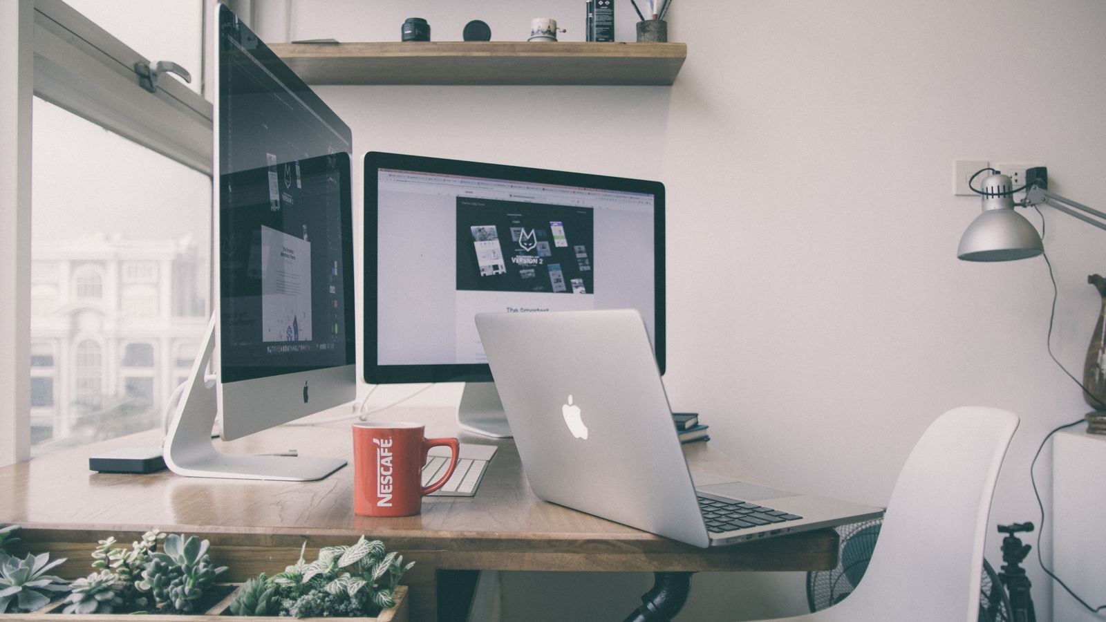 Sleek home office desk setup with dual monitors and minimalist accessories