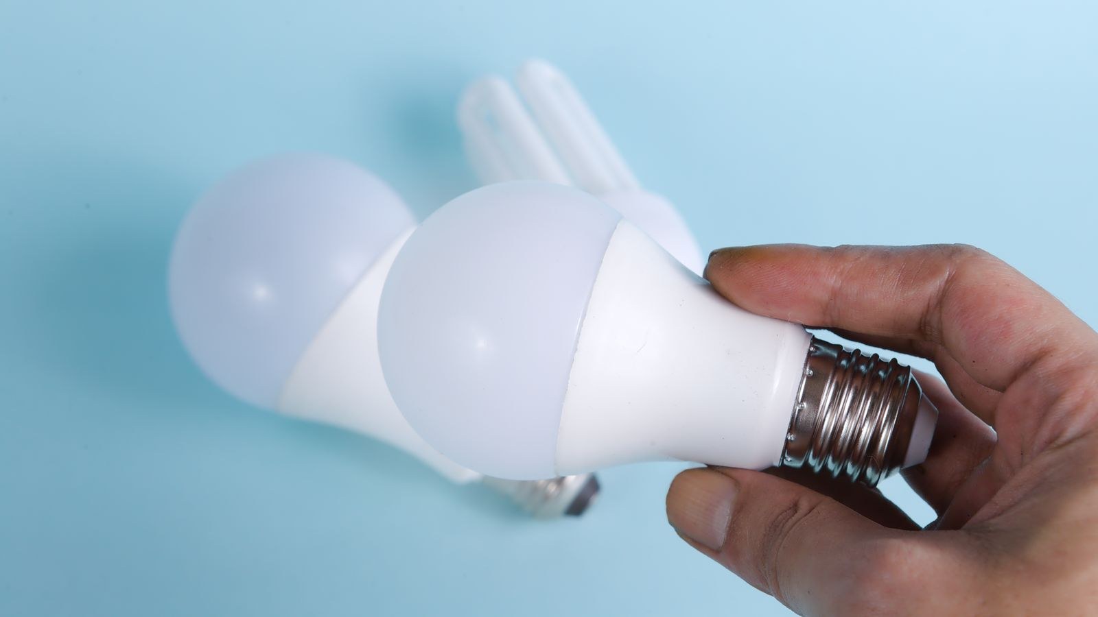Close up of screw and pin light bulb bases side by side