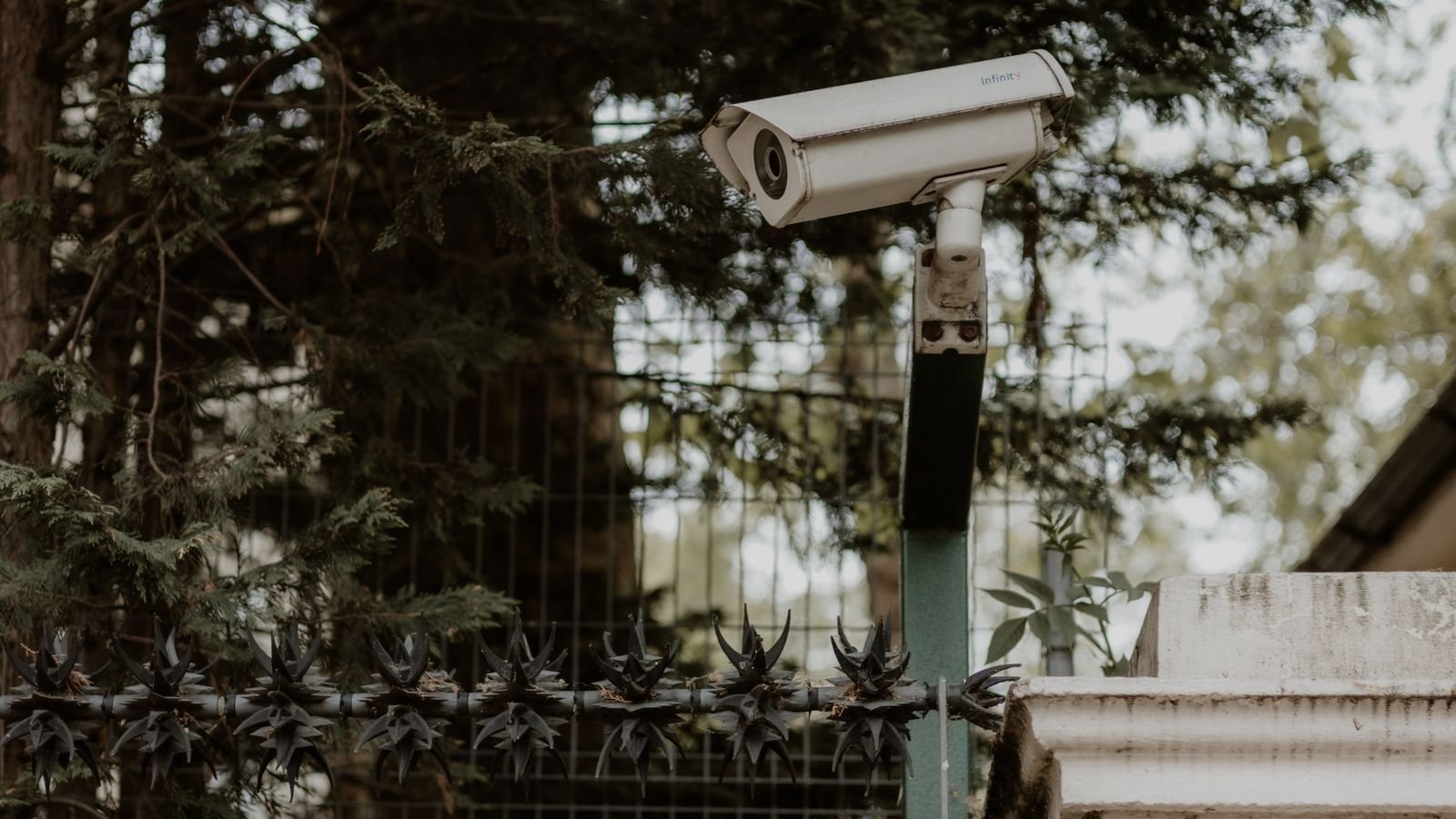 Security camera monitoring the entrance of a house at night