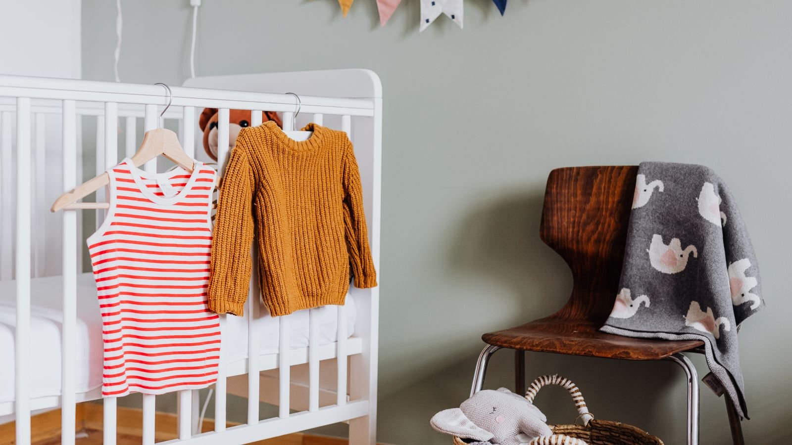 Cozy nursery interior with dimmable warm light bulbs and soft furnishings
