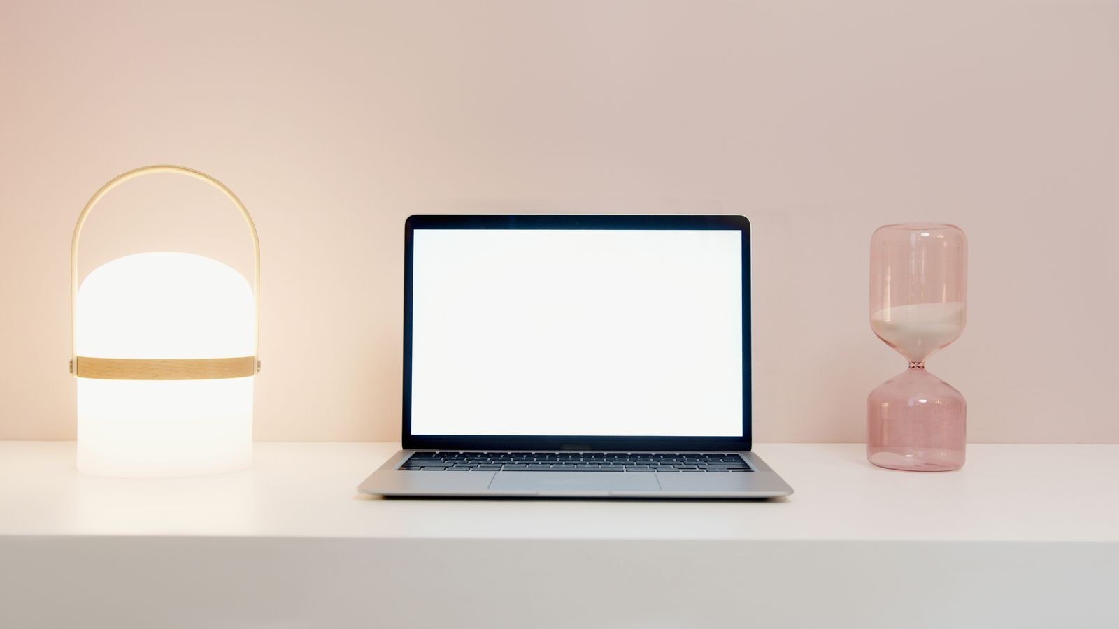 Minimalist desk with a modern lamp providing bright natural looking light