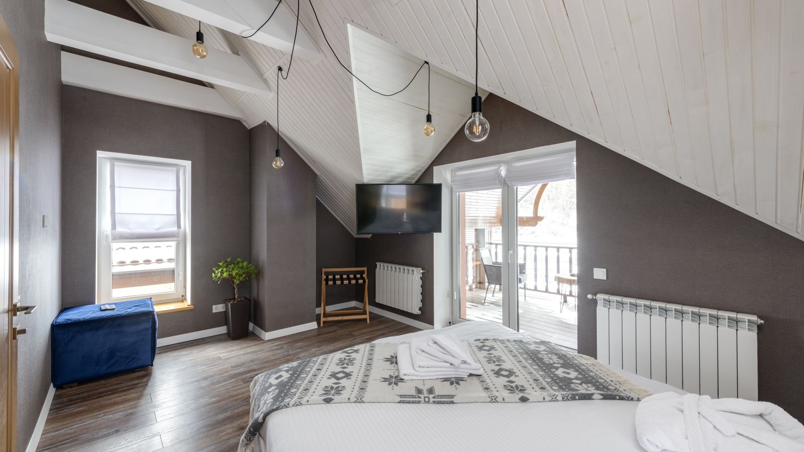 Flush mount ceiling fan with integrated light in a small bedroom