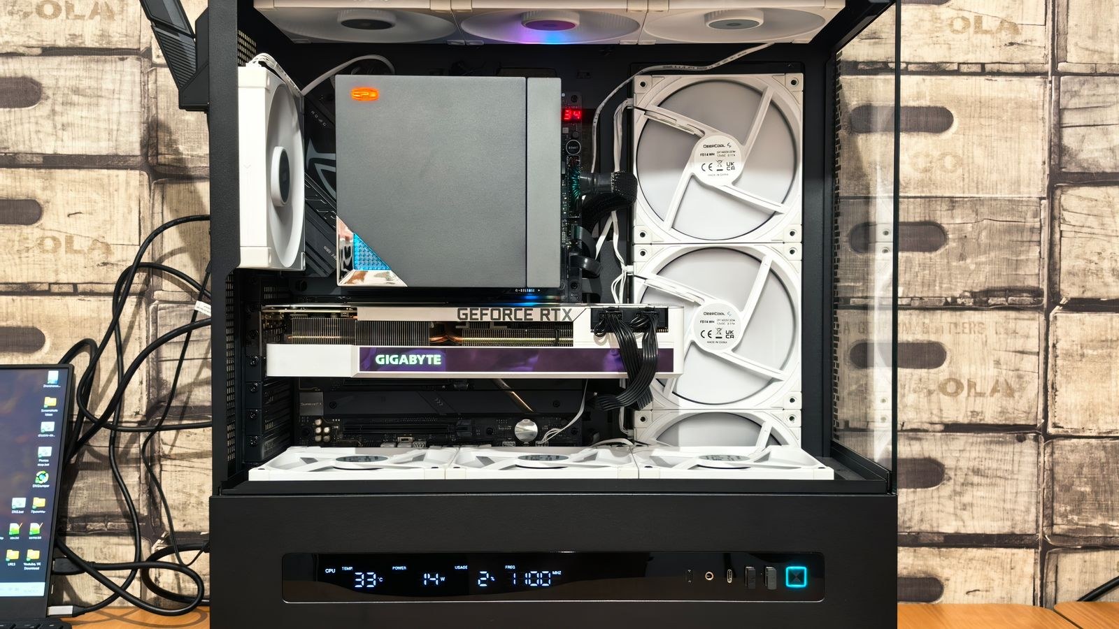 Person assembling components inside a spacious PC case