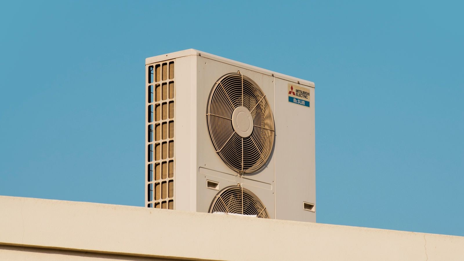 Outdoor condenser unit for a ductless mini split system on a rooftop