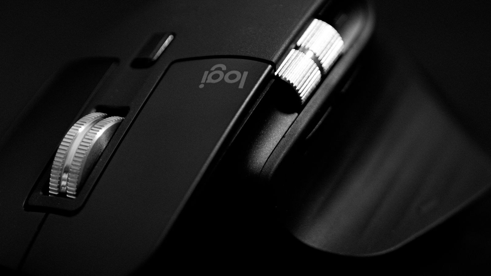 Close-up of a sleek black gaming mouse showing its shell profile