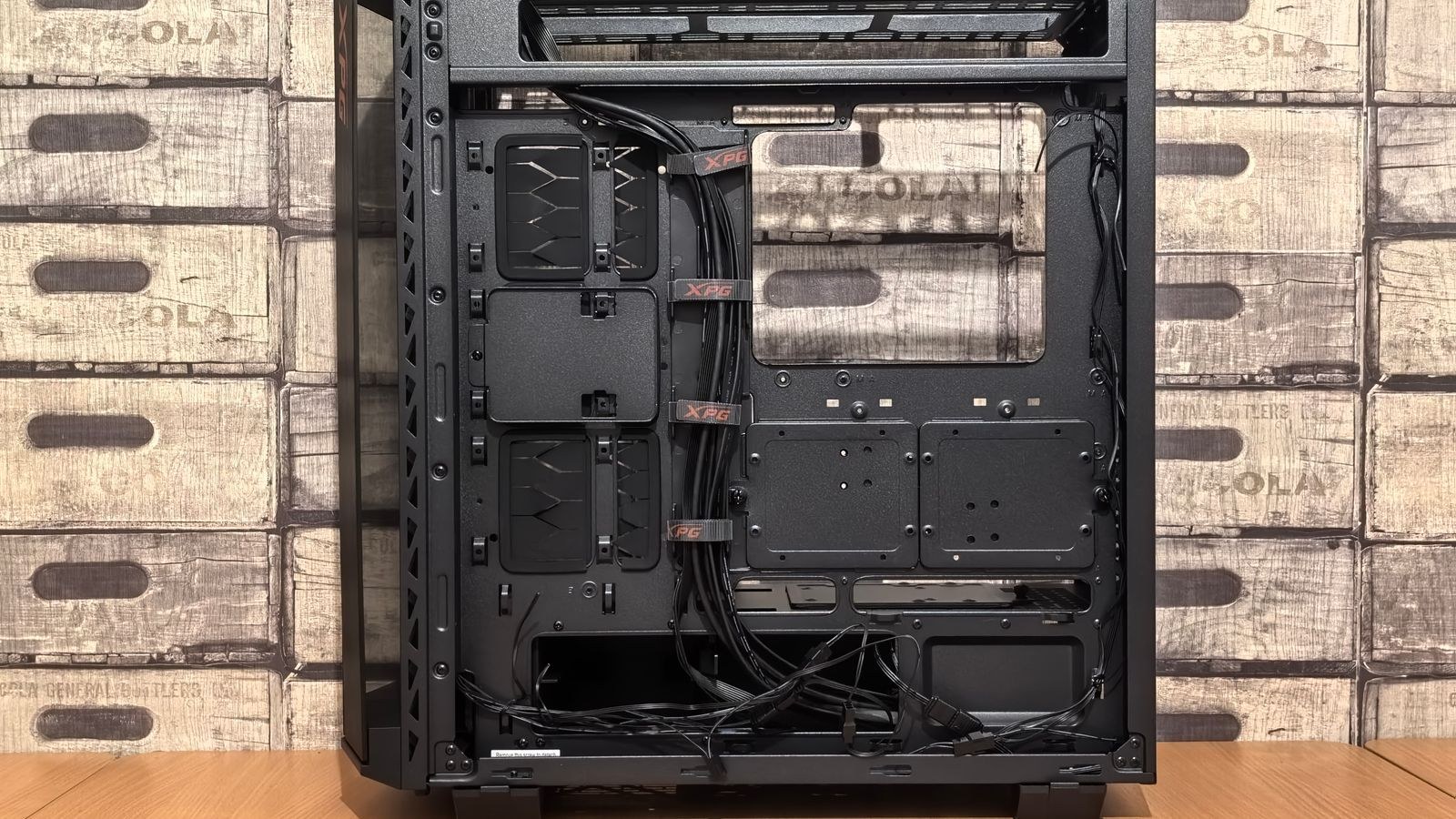 Open PC case with a screwdriver on the desk during a case swap