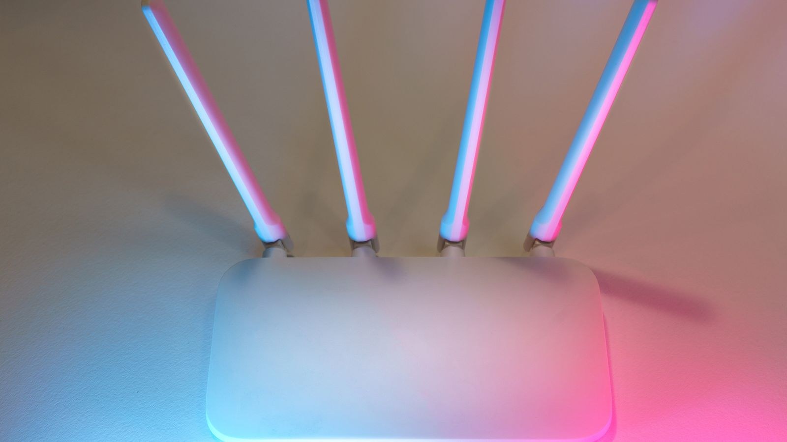 Wireless router with glowing indicator lights reconnecting smart home devices