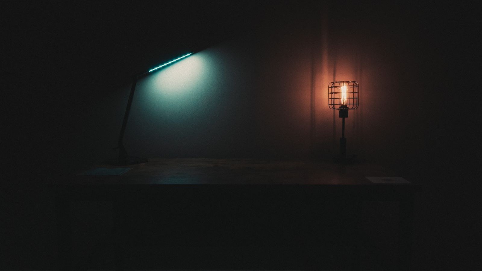 Soft plug-in night light illuminating a dark hallway near a doorway