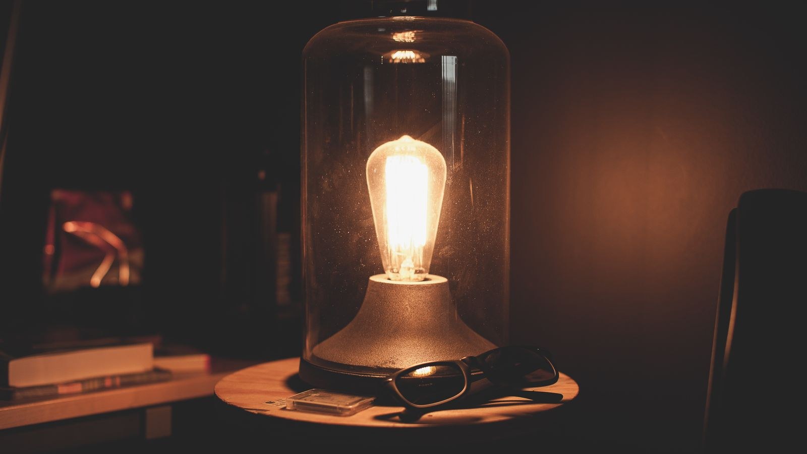 Small night light casting a gentle glow near a bathroom doorway at night