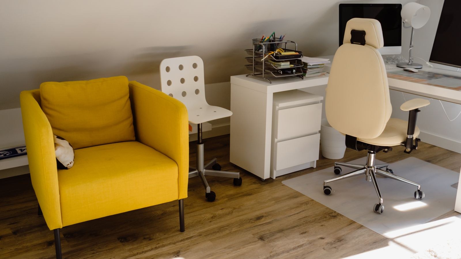 Home office with a comfortable task chair and tidy desk setup