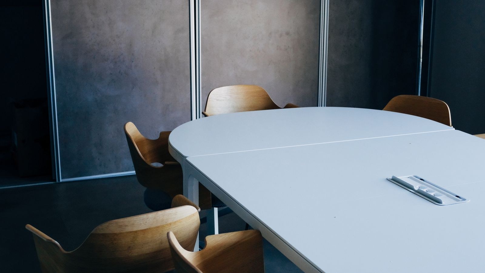 Modern office workspace with a task chair reclined at a desk