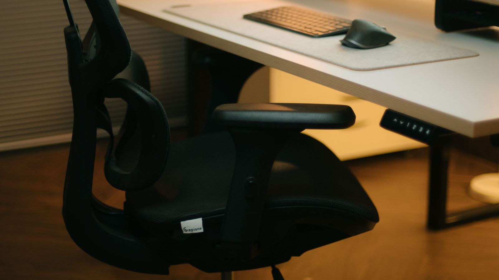Modern heavy duty office chair and desk setup with computer