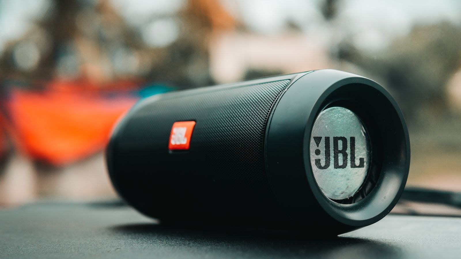 Portable wireless speaker with control buttons used for Bluetooth stereo pairing
