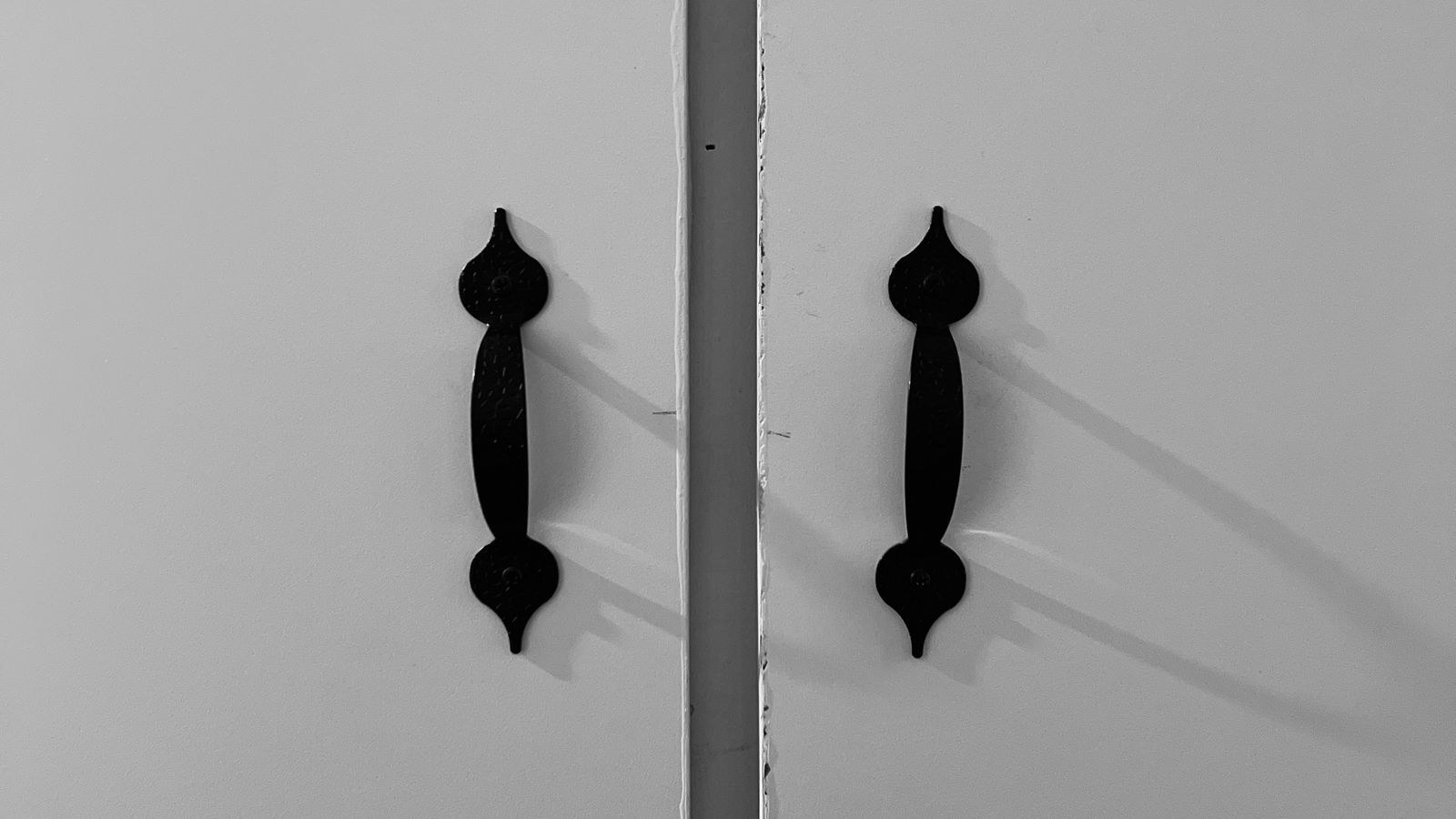 Door frame with a contact sensor mounted for home security monitoring